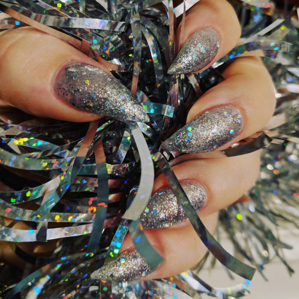 cropped hand woman holding tinsel