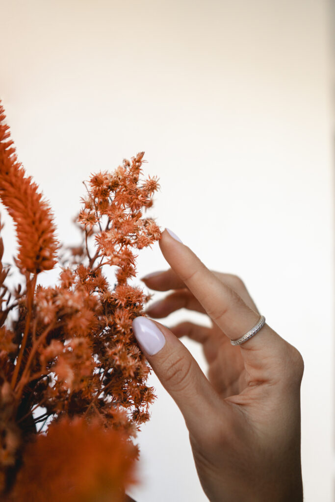 Fall Nail Art 2025: Cozy, Chic, and Totally On-Trend woman showing hands form support